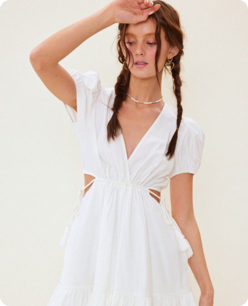 Fashion model showcasing elegant white outfit